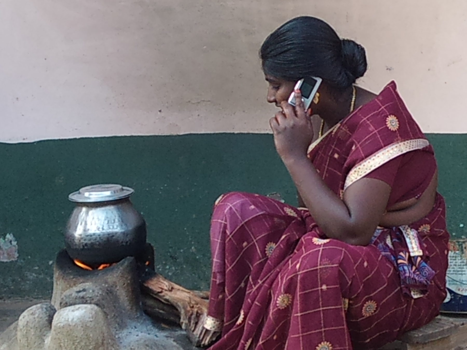 A woman in rural Tamil Nadu using a mobile phone